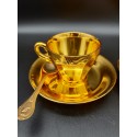 A pair of gold-plated coffee cups with spoons