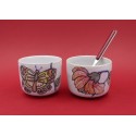 Two vintage stacked ceramic cups with retro butterfly and flower pattern 1970s
